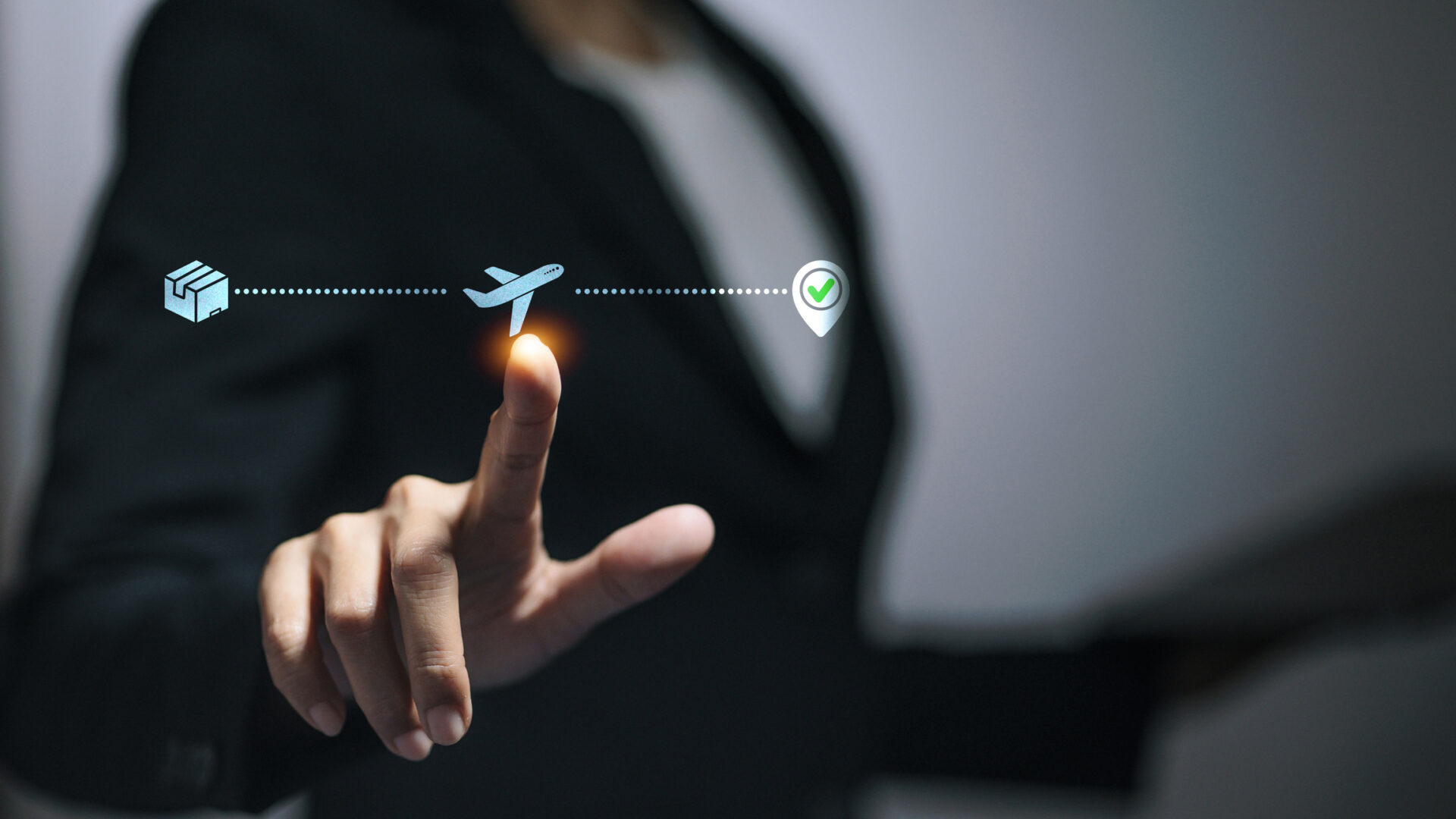 Person tapping airplane icon for package tracking