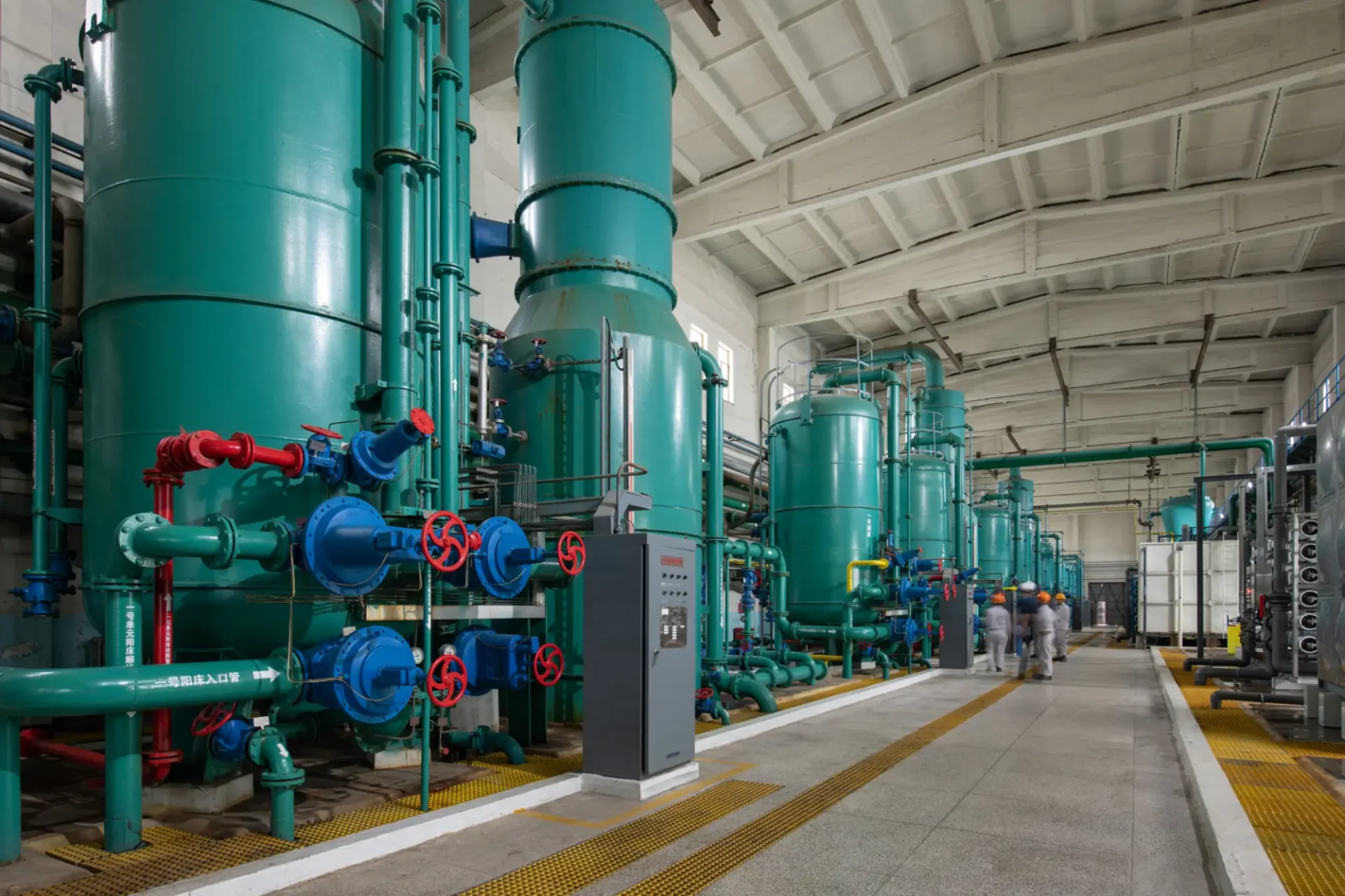 Industrial green tanks and piping with valves