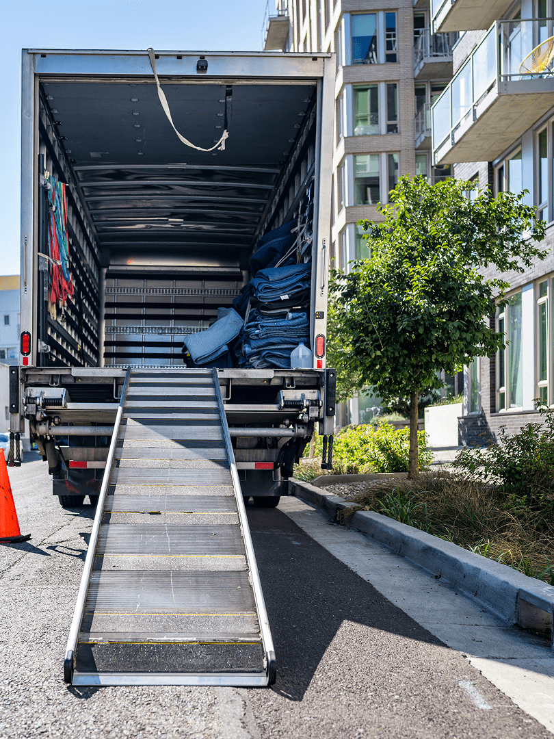 Open moving truck with loading ramp